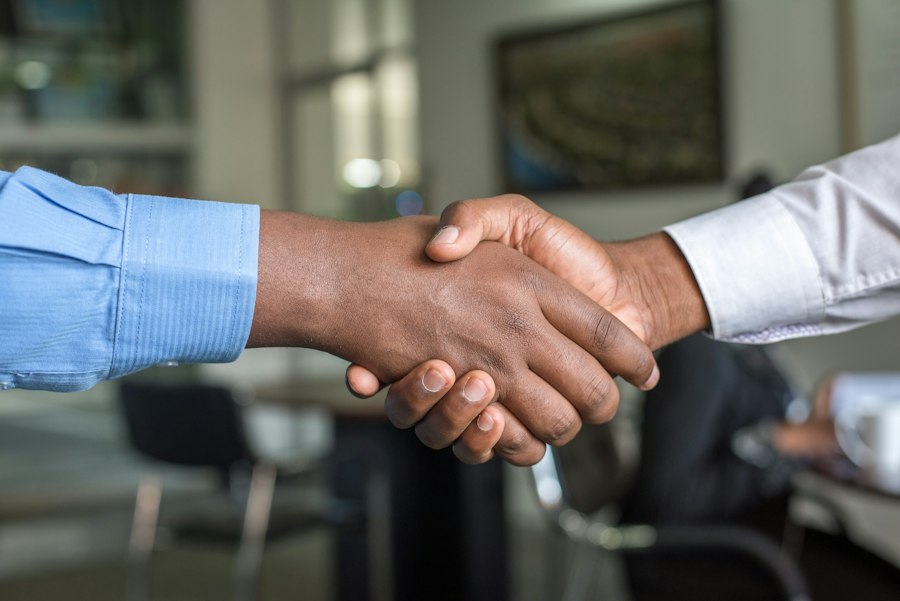 Relationship banking handshake at Encore